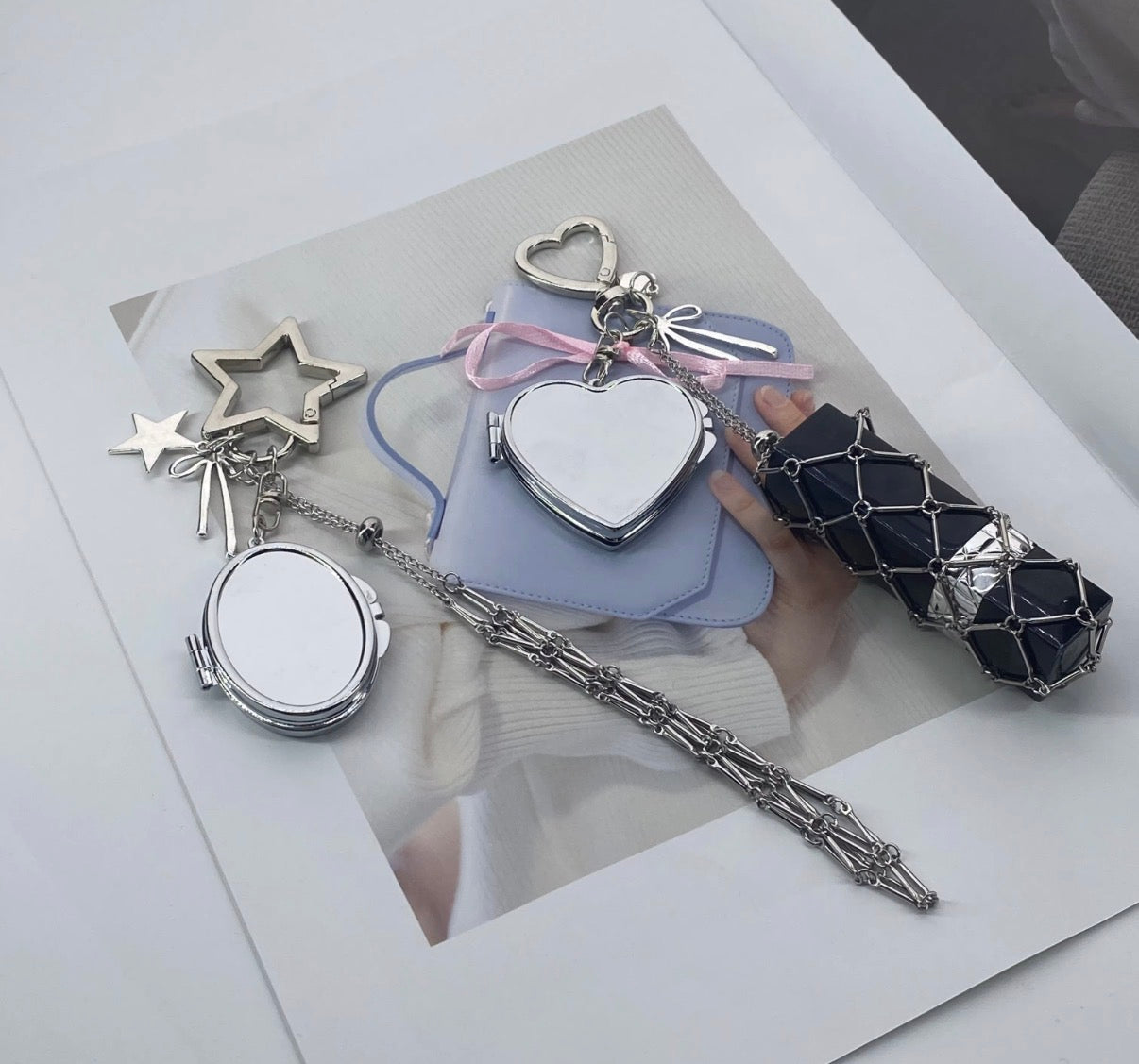 Lip balm holder & mirror bag charm.