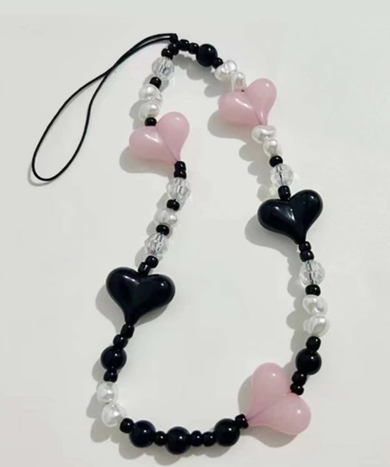 Neopink heart phone charm.