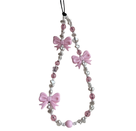 Pink bow phone charm.