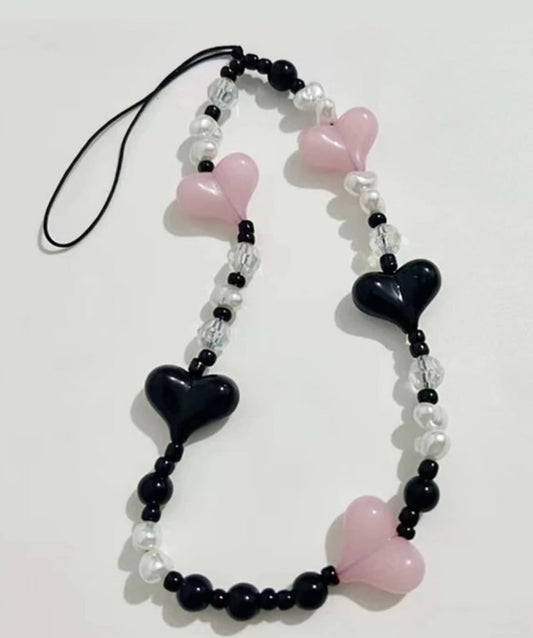 Neopink heart phone charm.